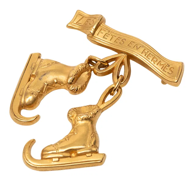 Gold Hermès Gold Plated Skate Boots Brooch in Gold from Designer Revival