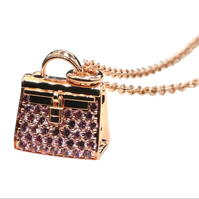 Hermès Amulettes Kelly Pink Sapphire Necklace in Pink from Luxury Promise