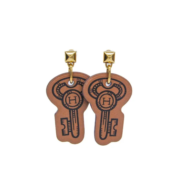 Hermès Brown Leather Earrings in brown|red Leather from Poshmark