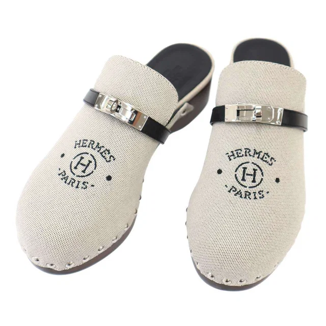 Hermès Carlotta Mules Clogs Logo Kelly Sandals Gray Black in Black from The Reluxe