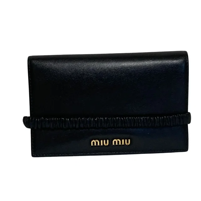 Miu Miu Leather Bifold Wallet with Band Black in Black Leather from The Reluxe