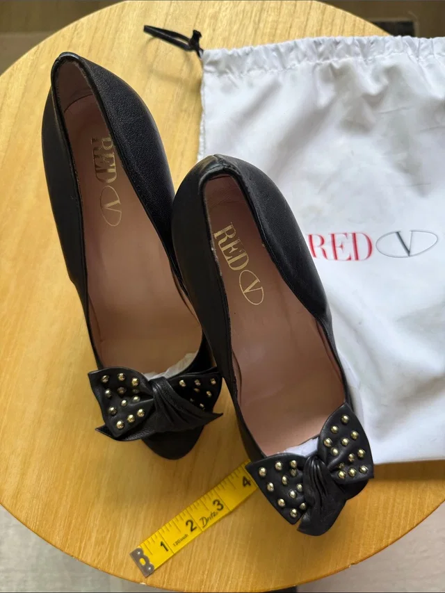 REDValentino Black Studded Bow Peep-Toe Heels in black|gold from Poshmark