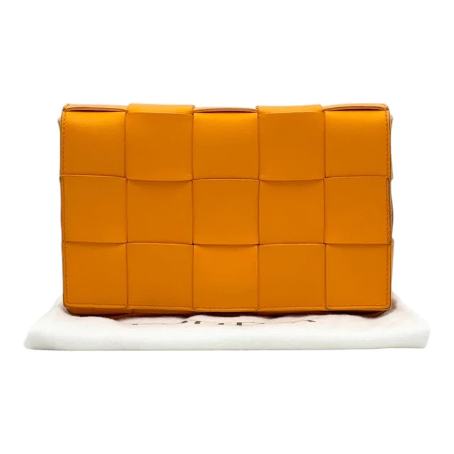 Bottega Veneta Orange Intrecciato Cassette Bag in Orange Woven leather from Luxury Promise