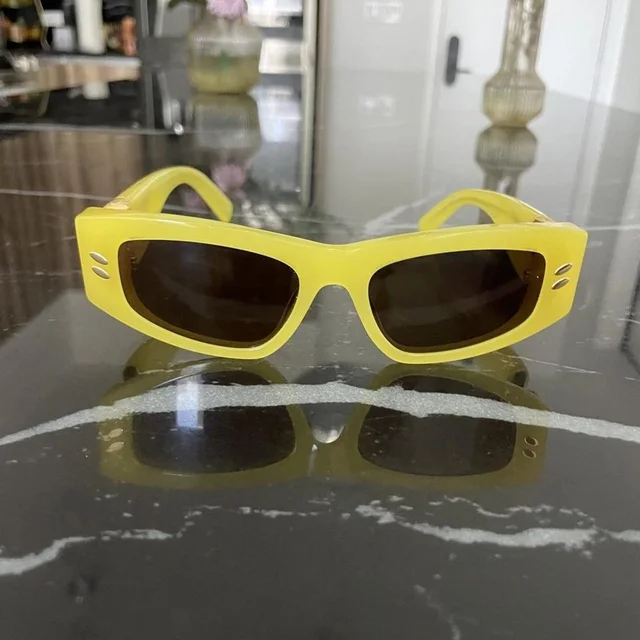 Stella McCartney Women's Cat eye Sunglasses - Yellow/Gold in yellow|gold from Depop, photo 1 of 1