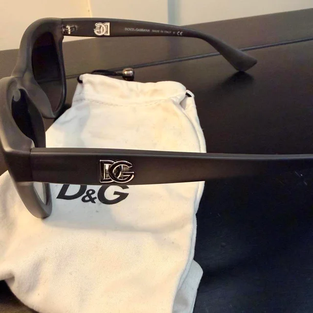 Dolce & Gabbana Women's Cat eye Sunglasses - Black/Brown in black|red|brown from Depop, photo 3 of 6