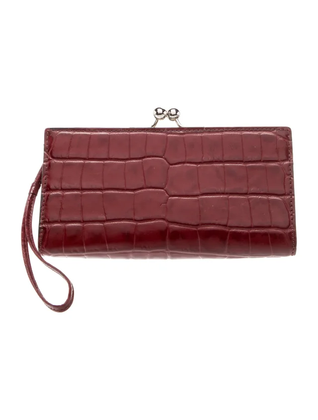 Burberry Embossed Leather Clutch in red Leather from The RealReal
