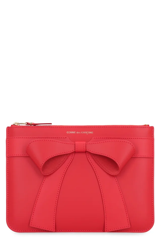 Comme des Garçons Bow-Appliqué Calf Leather Clutch — Red in Red Calfskin from HEWI