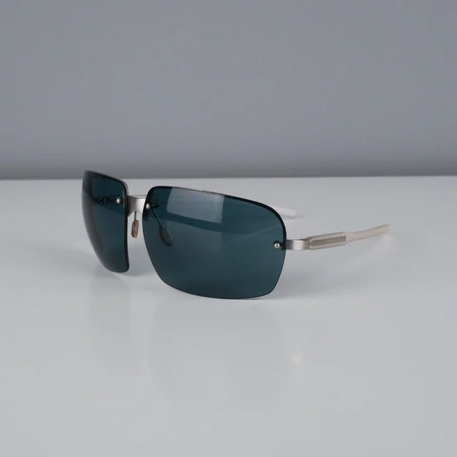 Prada Vintage Rectangular Rimless Transparent Sunglasses in Grey in gray from Grailed