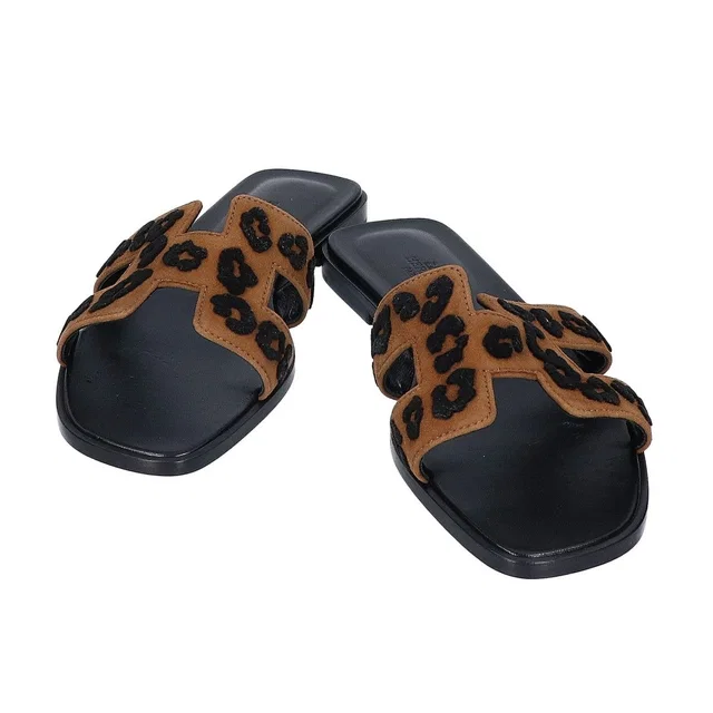Hermès Leopard Blanc Fume Oran Leather Sandals in White Leather from The Reluxe