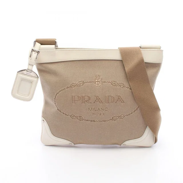 Prada Shoulder Bag Logo Jacquard Beige Ivory Canvas Leather in White Canvas from The Reluxe