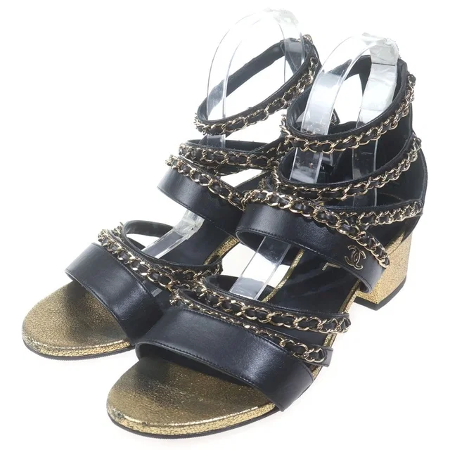 Chanel Open Shoes CC Logo Shu Heels Leather Sandals Chain Black Gold in Black Leather from The Reluxe