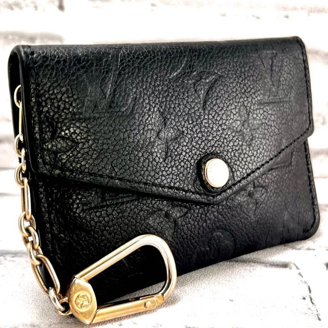 Louis Vuitton Monogram Empreinte Pochette Cles from The Reluxe