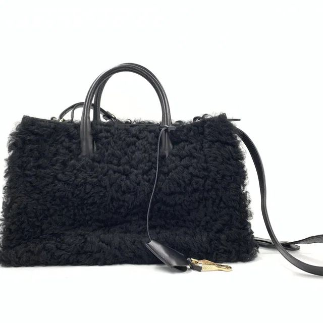 Balenciaga Black shearling handbag with leather accents in Black Leather from Luxury Promise