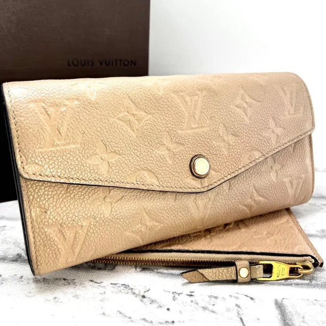 Louis Vuitton Empreinte Curies Dune Wallet from The Reluxe