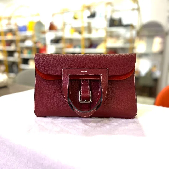 Hermès Burgundy Halzan 31 Clemence Leather in Burgundy Clemence leather from Luxury Promise