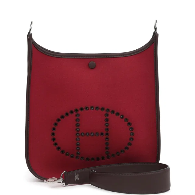 Hermès Neo Evelyne PM Rubis Officier Canvas and Rouge Sellier Swift Palladium Hardware in Red Swift leather from Madison Avenue Couture