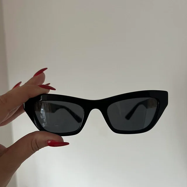 Versace Women's Cat eye Sunglasses - Black in black from Depop, photo 1 of 1