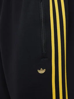 adidas Originals Wide-leg trousers with side detail in 54% Cotton, 43% Polyester, 3% Elastane, photo 2 of 2 from LUISAVIAROMA