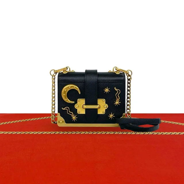 Prada Cahier Studs Logo Saffiano Leather Shoulder Bag Mini Pochette Crossbody in Saffiano leather from The Reluxe