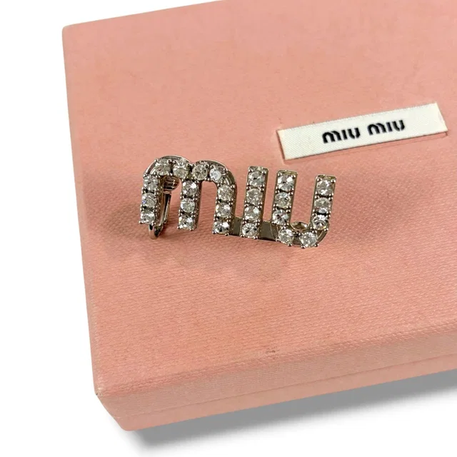 Miu Miu Crystal Logo Pierced Earrings Asymmetric Design Worn by Wonyoung from The Reluxe