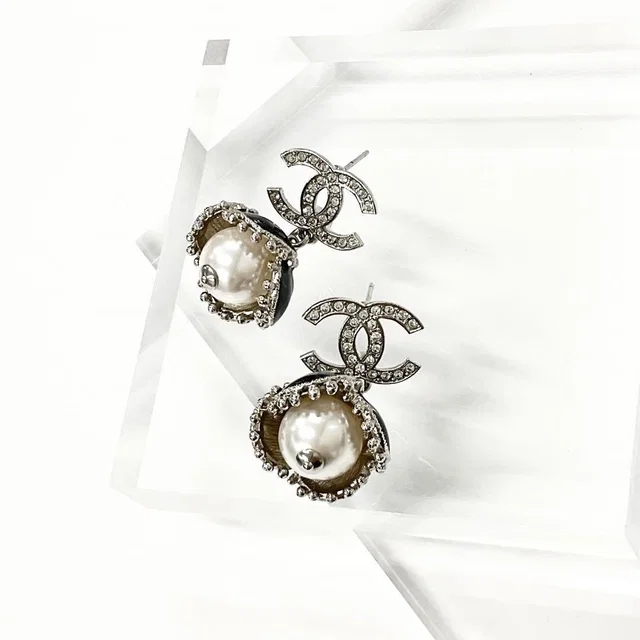 Chanel Coco Mark Rhinestone Pearl Flower Silver in Silver from The Reluxe