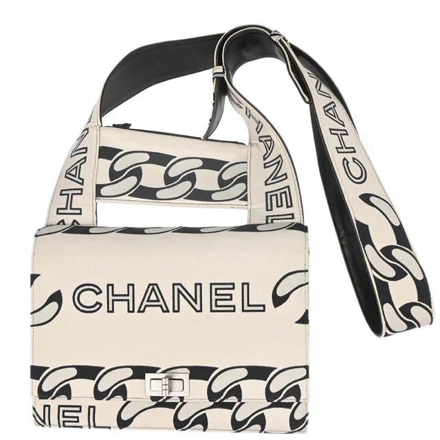 Chanel 2002-2003 Beige Black Canvas Graphic Logo Mademoiselle Lock Shoulder Bag in Black Canvas from AMORE Vintage Tokyo