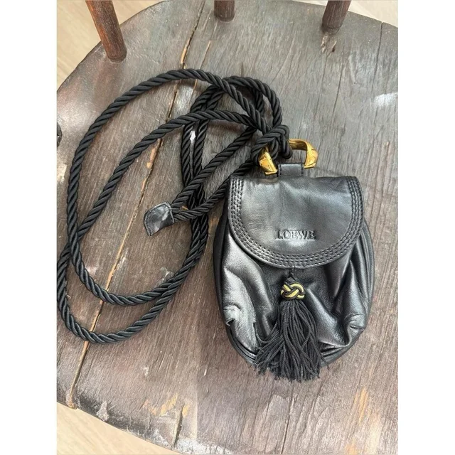 Loewe Women's Bag - Gold/Black in black|gold from Depop, photo 1 of 1