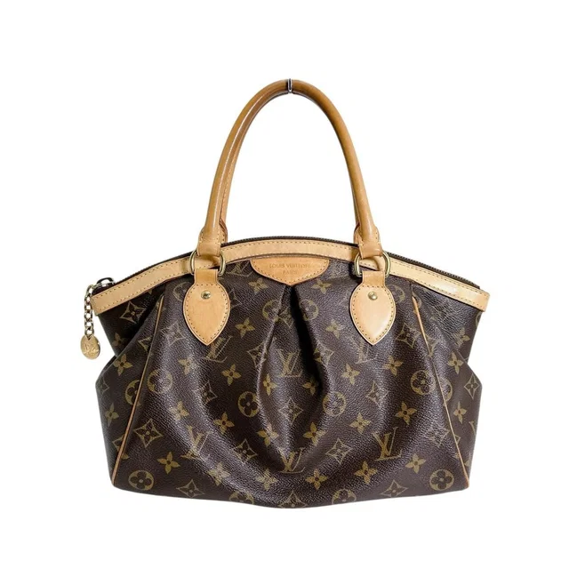 Louis Vuitton Monogram Handbag Tivoli PM Brown in Brown Coated canvas from The Reluxe