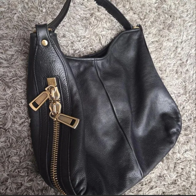 Saint Laurent Women's Bag - Black/Gold in black|gold from Depop, photo 1 of 1