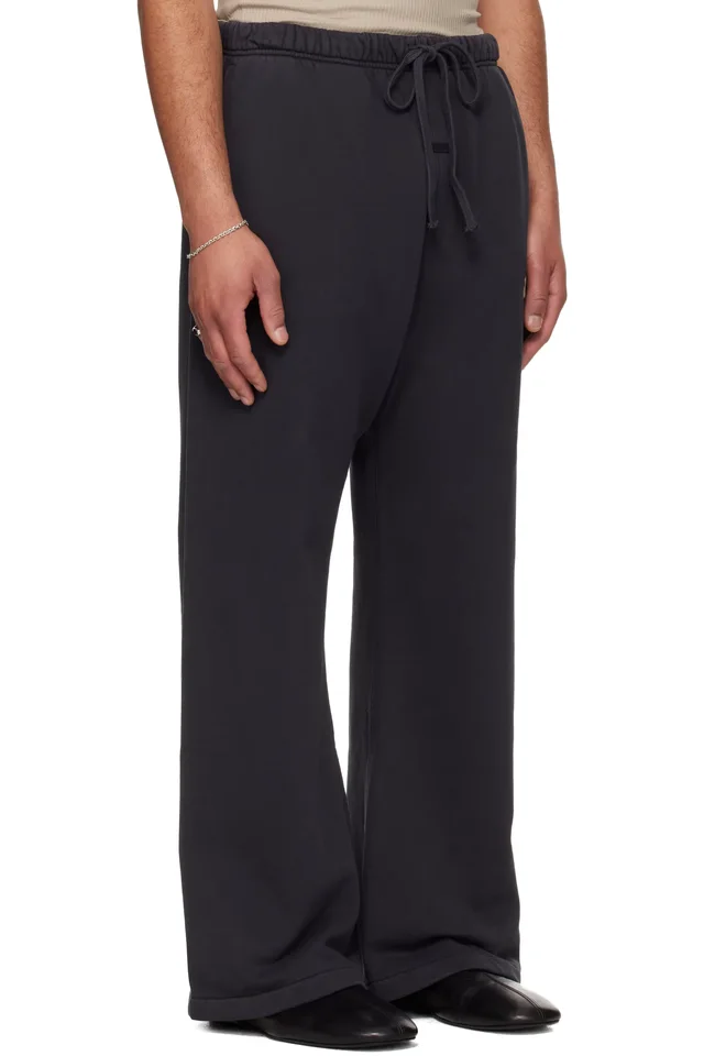 Fear of God ESSENTIALS Black Training Classic Flare Sweatpants, photo 2 of 4 from SSENSE