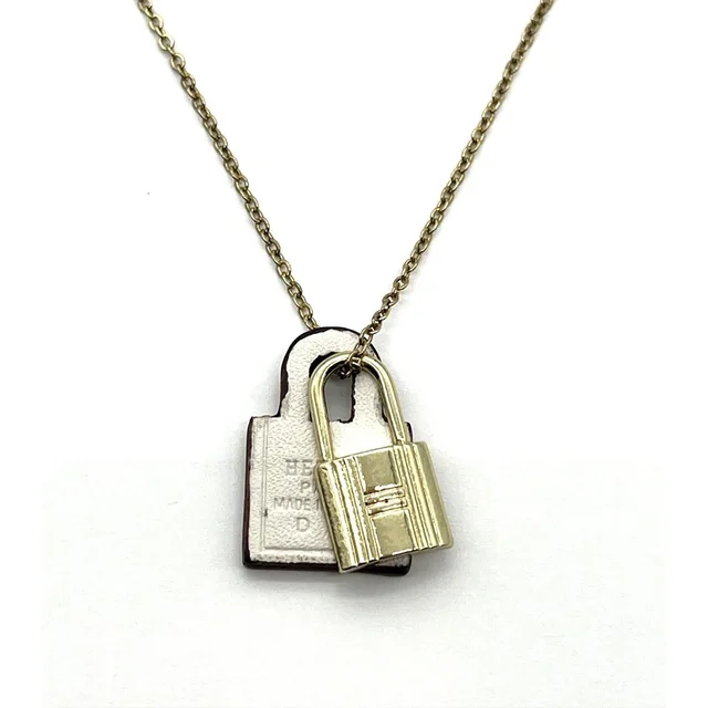 Hermès O'kelly Pm Pendant Necklace Gold Plated White Leather D Fm in gold|white Leather from Poshmark, photo 1 of 1