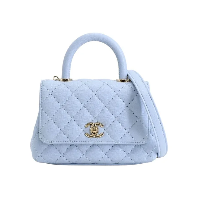 Chanel Handbag Top Handle Mini Flap Bag in Caviar leather from The Reluxe