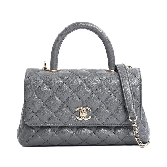 Chanel Handbag Top Handle Flap in Caviar leather from The Reluxe