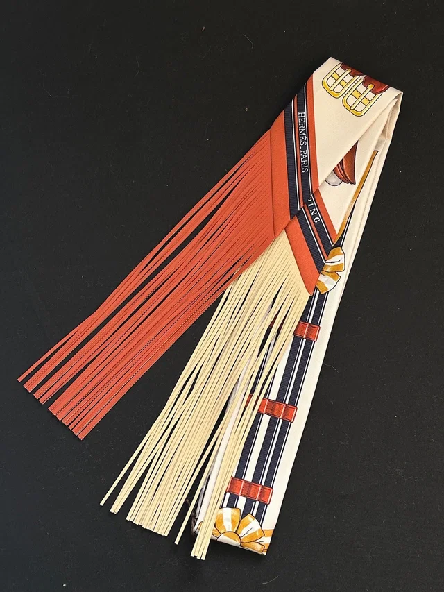 Hermès Twilly Twill Jumping Fringe - Cream / Orange / Anthracite in White Silk from Luxury Promise