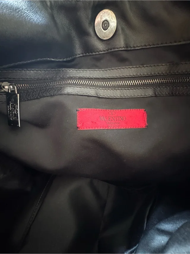 Valentino Garavani Black Backpack With Red Logo Patch Interior in black|red from Poshmark, photo 1 of 1