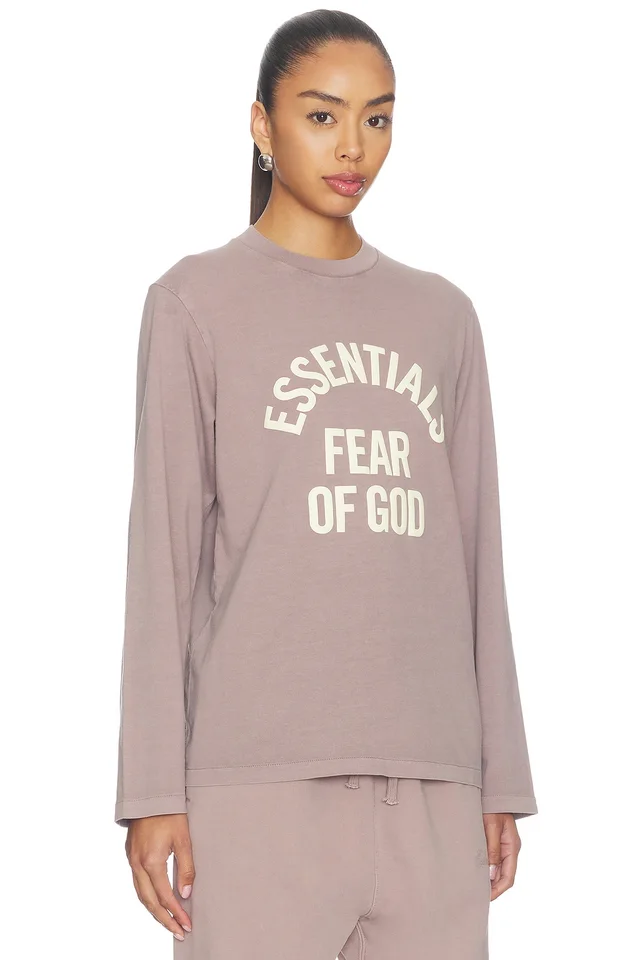 Fear of God ESSENTIALS Campus Classic Long Sleeve Tee in Faded Mauve, photo 2 of 4 from REVOLVE (Canada)