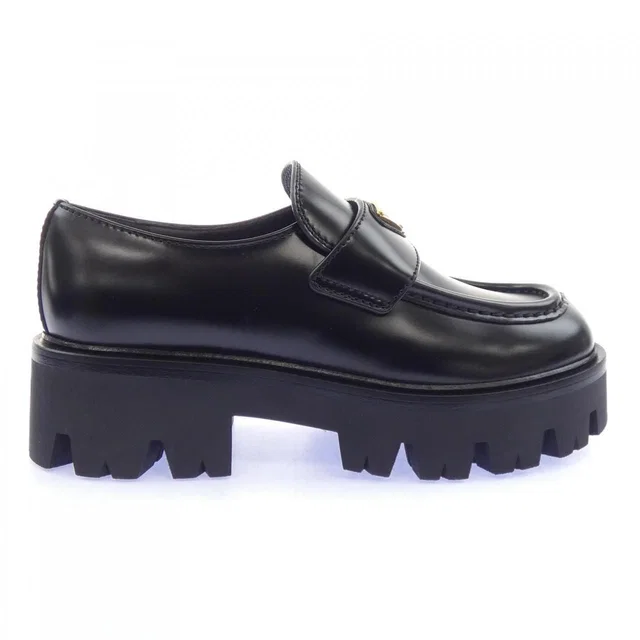Prada Triangle Logo Sneakers in Leather from The Reluxe