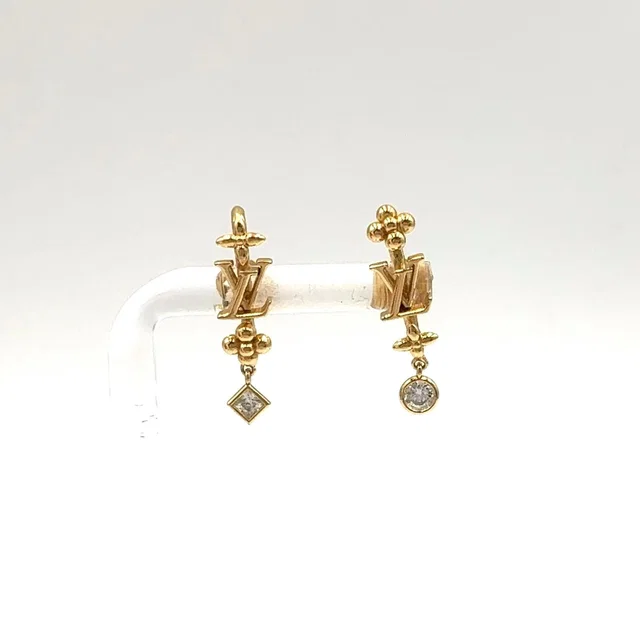 LV in the Sky Gold Plated Earrings in Gold from The Reluxe