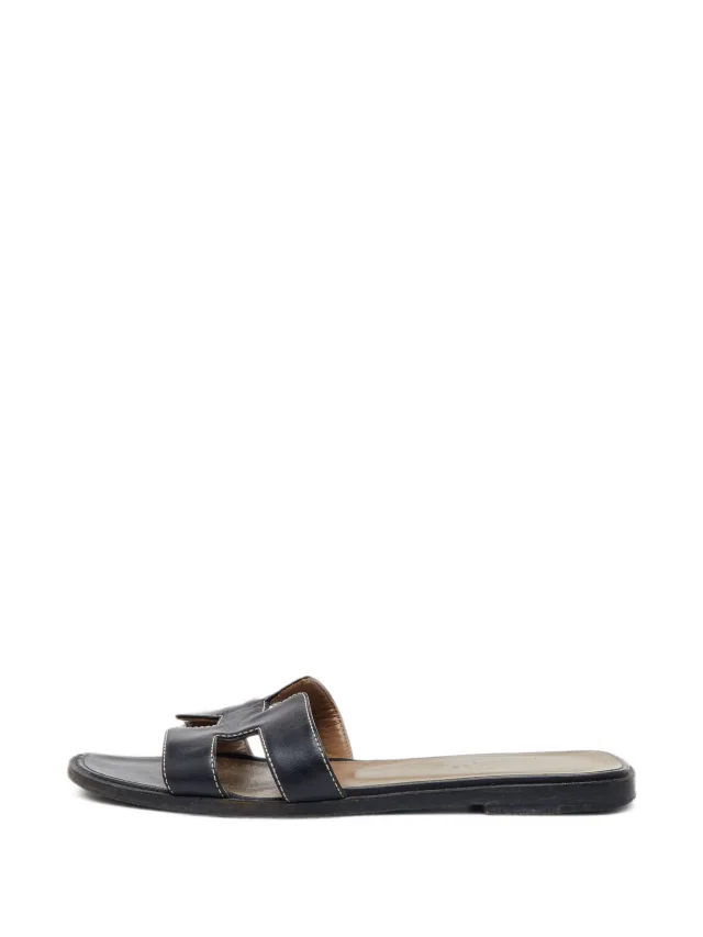 Hermès Pre-Owned Oran H-shaped Slides | Black | FARFETCH in Black Calfskin from Farfetch