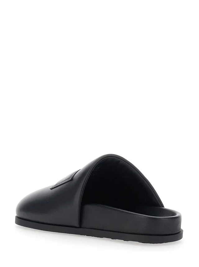 GIVENCHY Black Mules with Asymmetrical Design and Padded Leather Logo Women in Black 100% Lamb, photo 6 of 8 from Gaudenzi Boutique