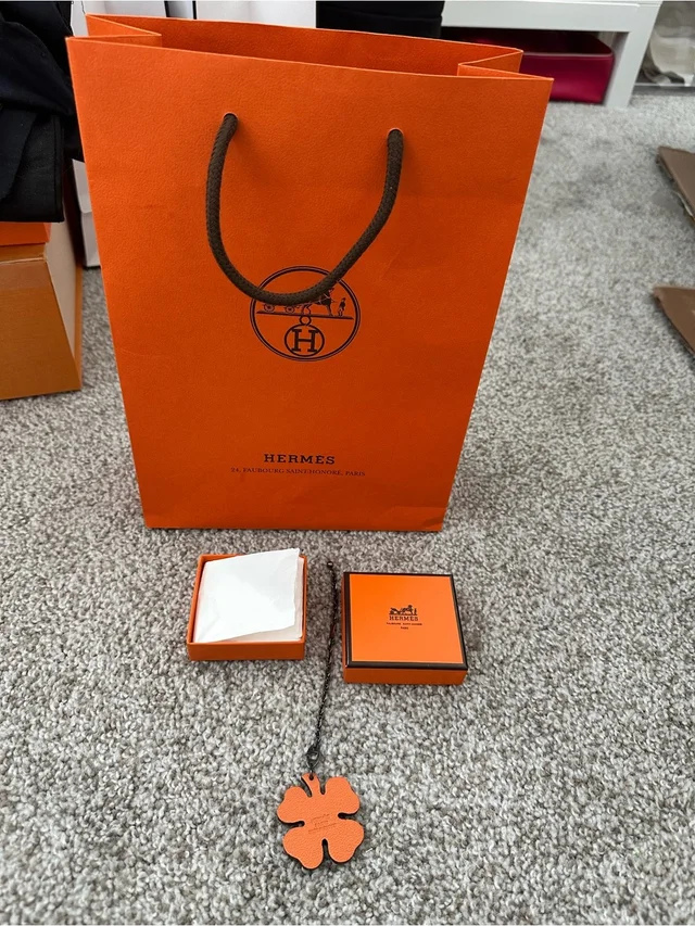 Hermès Orange Leather Clover Pendant Charm. Authentic in orange|brown|red Leather from Poshmark, photo 2 of 7