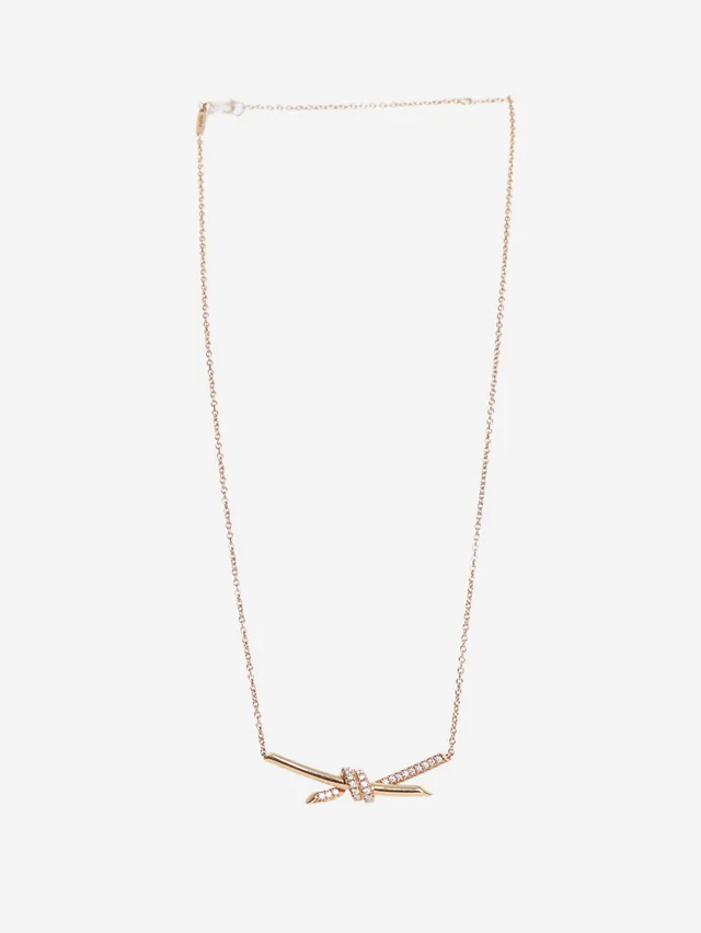 Tiffany & Co. 18k Rose gold knot pendant from Sign of the Times