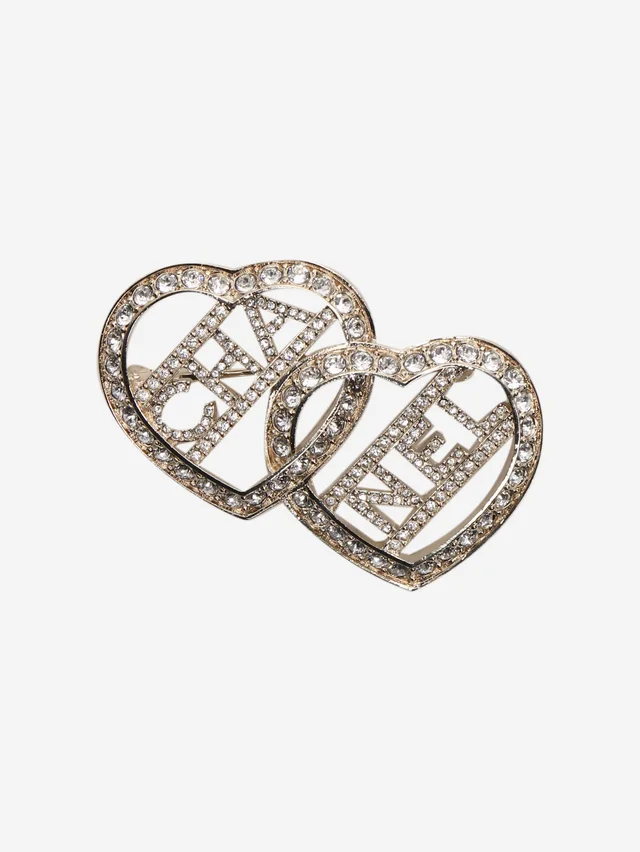 Chanel Silver diamante double heart brooch in Silver from Sign of the Times