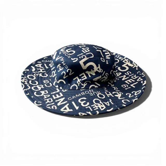 Chanel By Sea Logo CC Bucket Hat Navy Cotton in Navy from The Reluxe