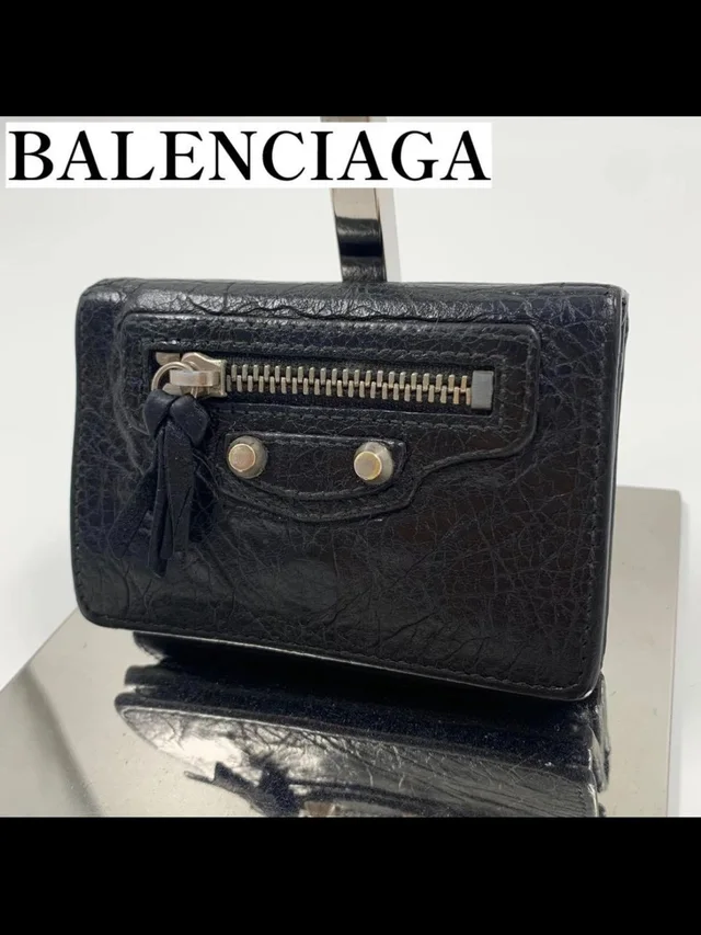 Balenciaga Textured Leather Mini Wallet With Tassel Zip in black Leather from Poshmark