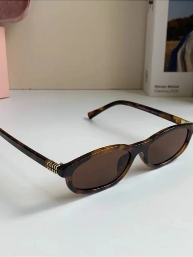 Miu Miu Tortoiseshell Oval Sunglasses With Brown Lenses in red|brown from Poshmark