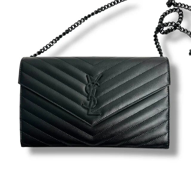 Saint Laurent Cassandre Matelasse Chain Wallet Black Grain De Poudre Leather in black Leather from Poshmark, photo 1 of 1