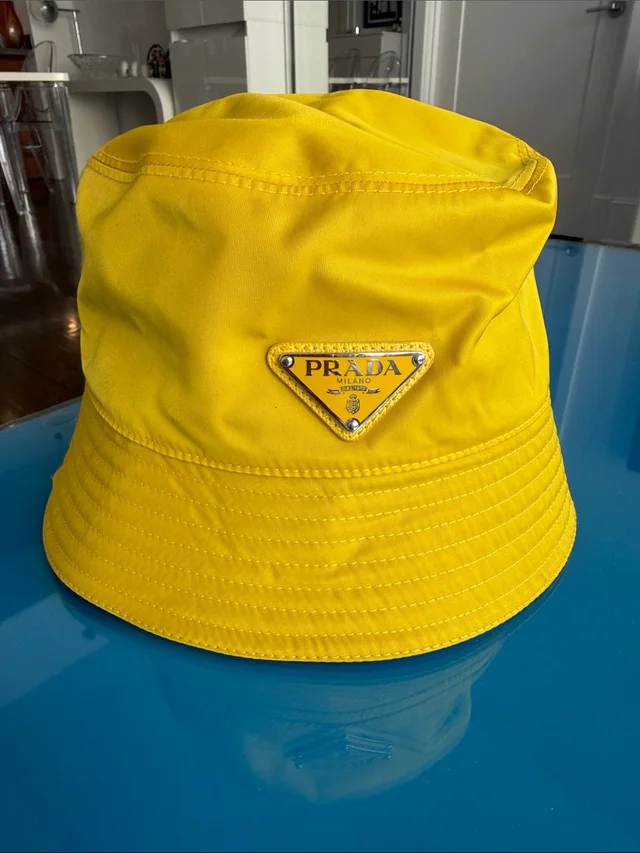 Prada Bright Yellow Re-Nylon Bucket Hat With Logo in yellow Nylon from Poshmark, photo 1 of 1