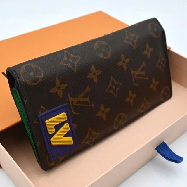 Louis Vuitton Monogram Rubber Portefeuille Brazza NM Wallet from The Reluxe