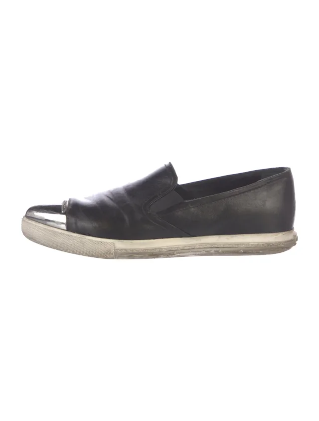 Miu Miu Leather Sneakers in black Leather from The RealReal